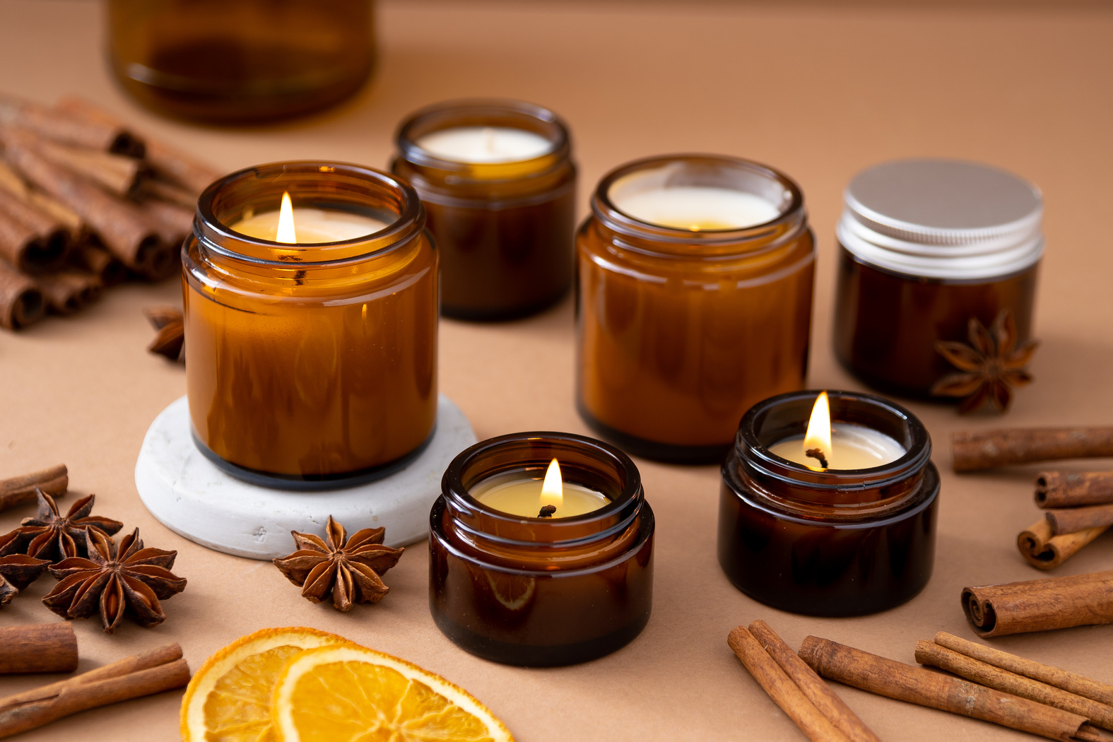 A Set of Different Aroma Candles in Glass Jars on a White Background. Scented Handmade Candle. Soy Candles Are Burning in a Jar.Wax and Paraffin in a Jar