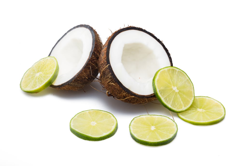 Cracked coconut with slices of lime